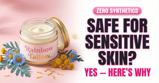 Rainbow Tallow glass jar with Blue Tansy flowers on a soft blush background — anti-inflammatory grass-fed tallow safe for sensitive, eczema-prone, and reactive skin